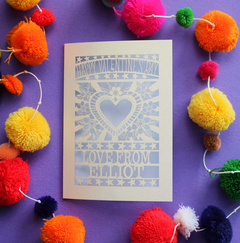 A paper cut personalised Valentines card that has a heart and flowers cut out and text that says "Happy Valentine's Day, love from" and a name - Lilac / A6 (small)