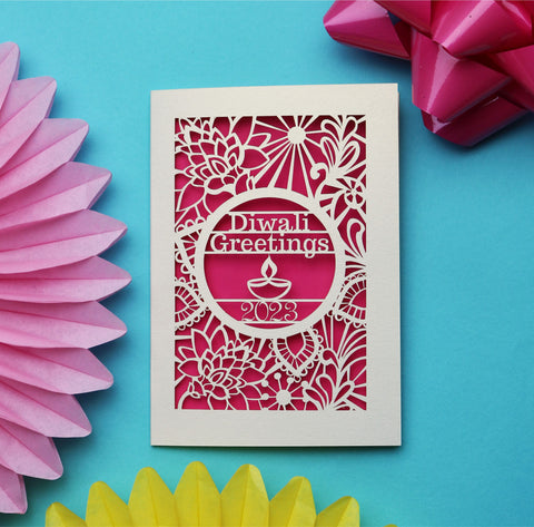 A laser cut Diwali Card that says "Diwali Greetings 2023" and is surrounded by floral henna-style patterns.  - 