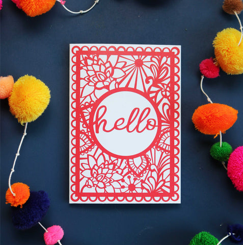 A card with hello in a border of floral designs