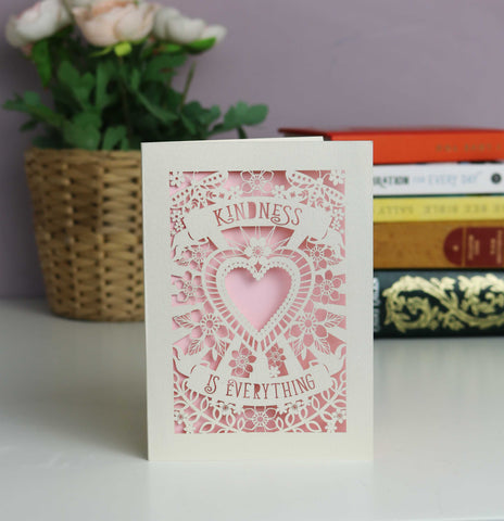 Pretty in pale pink "Kindness is everything" papercut card. Cut from cream card with a baby pink insert. Shows a cutout heart surrounded with flowers and butterflies. - A5 (large) / Candy Pink
