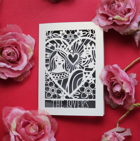 A laser cut greetings card featuring an illustration inspired by the lovers tarot card