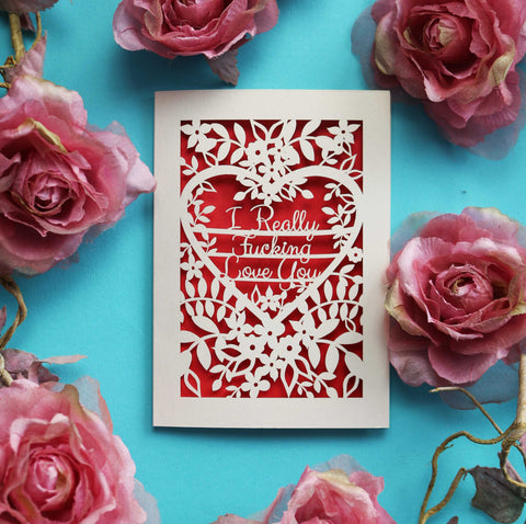 A laser cut Valentine's card that says "I really fucking love you" surrounded by flowers and leaves - A5 (large) / Bright Red