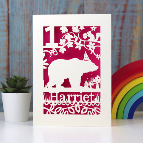 Personalised papercut card for birthday. Shows a bear in his hat!  Walking in the woods under a tree with a squirrel above him. Can be personalised with a name and age. Cut from card with a shocking pink insert. - A5 (large) / Shocking Pink