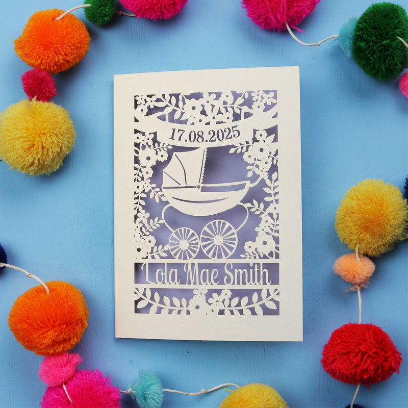 a laser cut new baby card