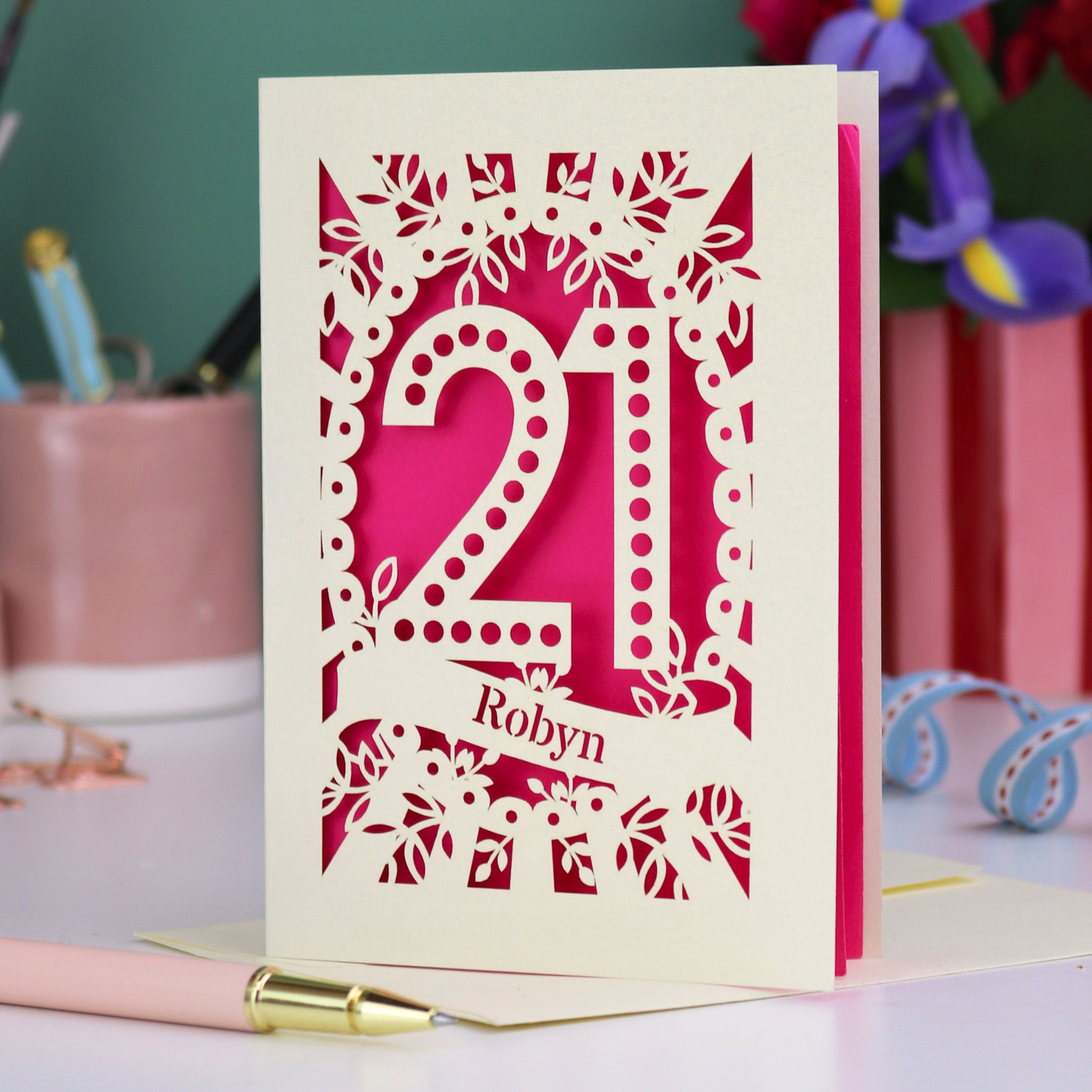 A laser cut birthday card with cupcakes on a cake stand