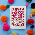 Laser-cut 18th birthday card with colourful pom-poms on a blue background