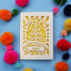 Laser-cut 18th birthday card with colourful pom-poms on a blue background