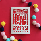 A laser cut birthday card for people born in 1974