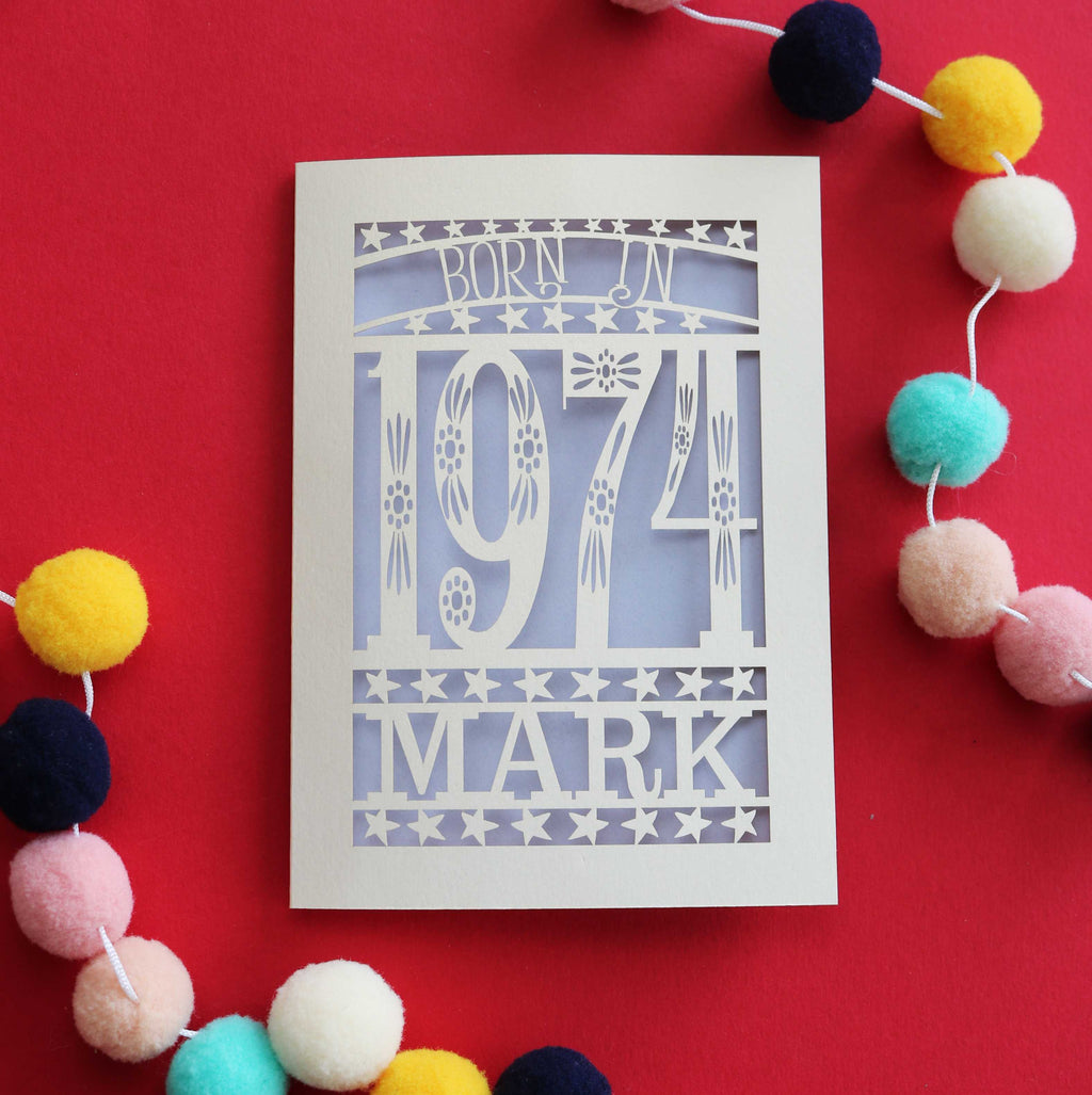 A paper cut 50th birthday card for people born in 1974