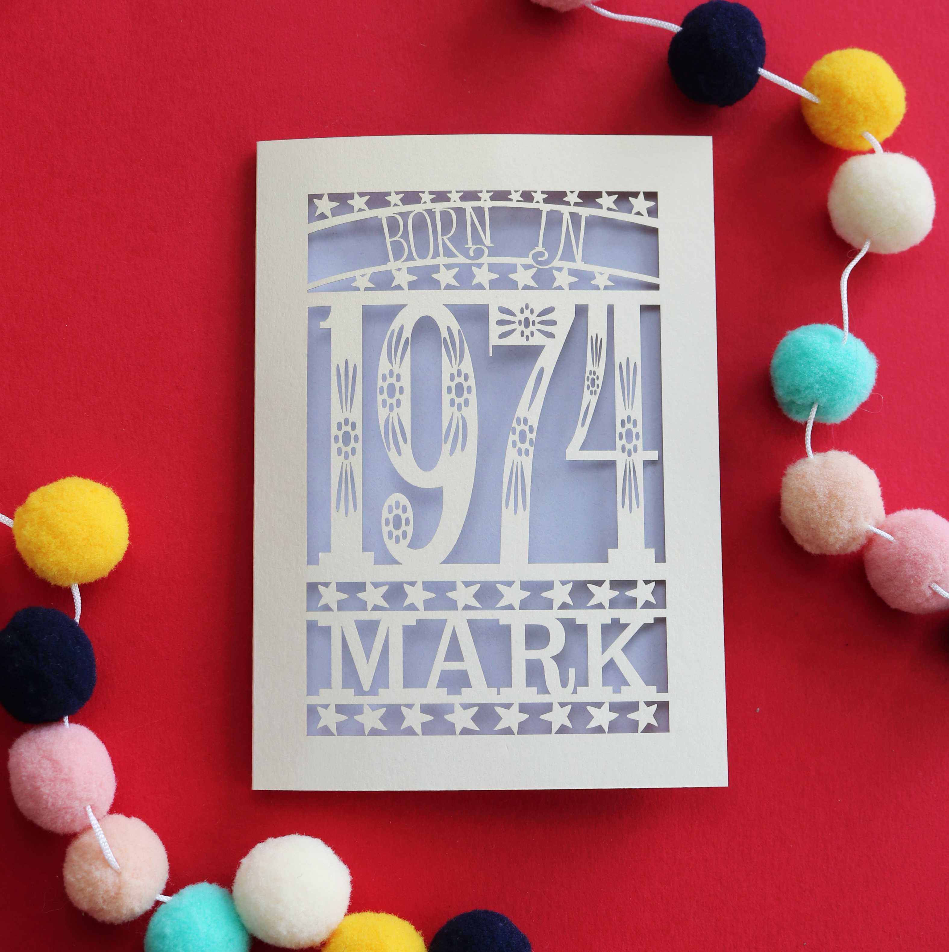 A paper cut 50th birthday card for people born in 1974