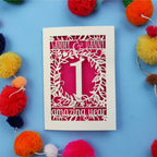 First wedding anniversary Card with cut-out design on a blue background with colourful pom-poms