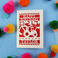 Personalised 1st Birthday card with a tractor design and 'Happy Birthday Taylor' text on a blue background with colourful pom-poms.