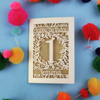 Personalised 1st birthday card with decorative elements on a blue background