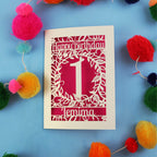 Personalised 1st birthday card with decorative elements on a blue background