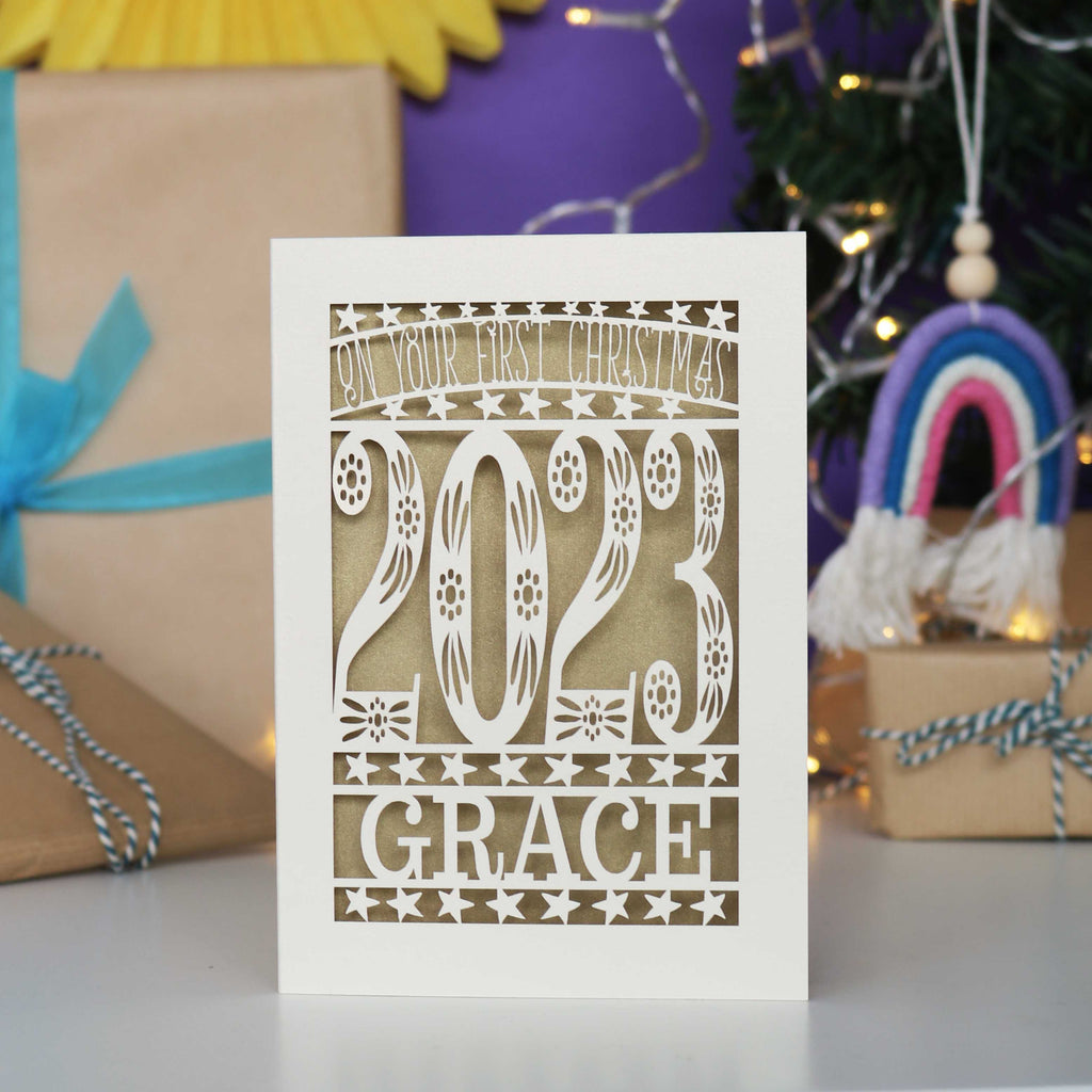 Cream and gold personalised 1st Christmas  card.