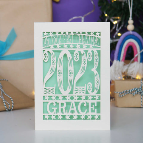 A personalised 1st Christmas cards cut from cream  card with a pretty light green insert. - A5 / Light Green