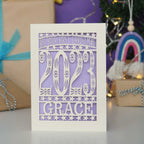 Personalised papercut cream card with lilac insert. Great for baby's 1st Christmas.