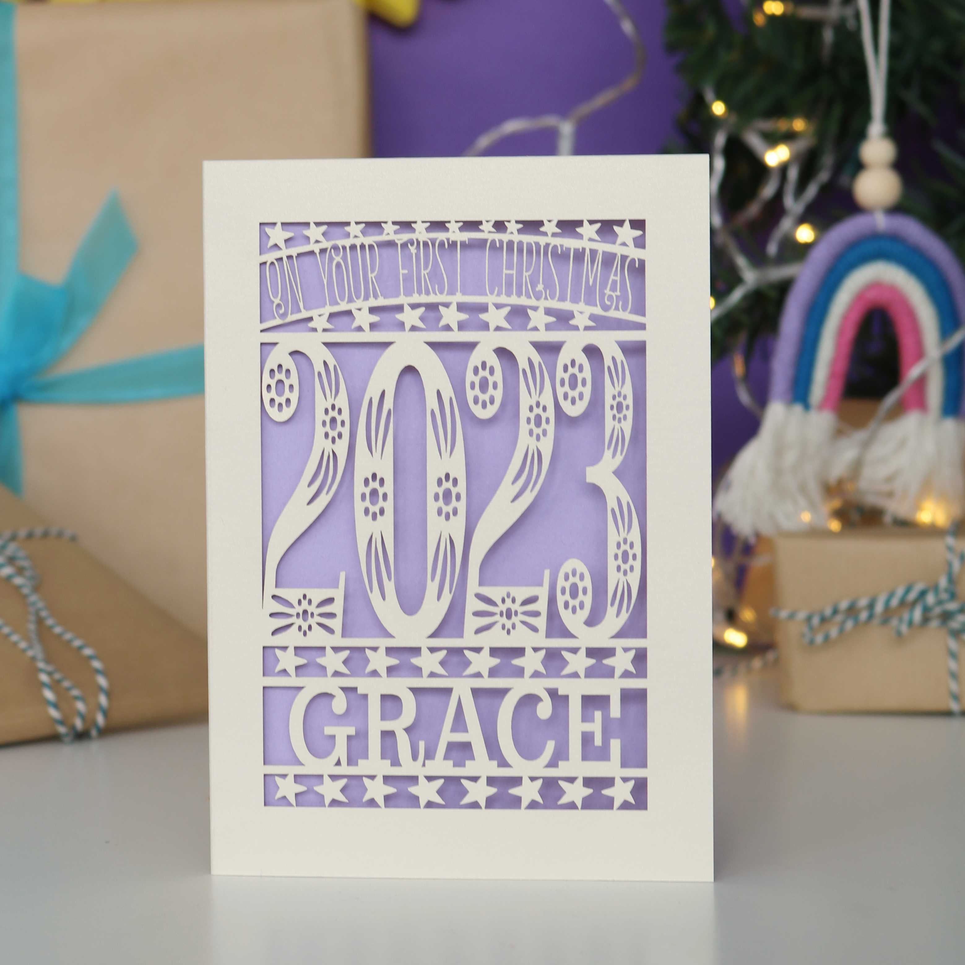 Personalised papercut cream card with lilac insert. Great for baby's 1st Christmas.
