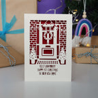 A Happy First Christmas in your New Home laser cut Christmas card, personalised with their names.