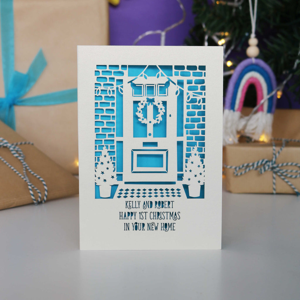 A Happy First Christmas in your New Home Card, personalised with their names and laser cut to order in the UK.