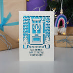 A Happy First Christmas in your New Home Card, personalised with their names and laser cut to order in the UK.