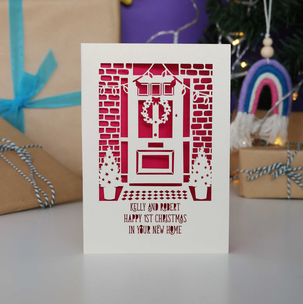 A Happy 1st Christmas in your New Home Card from the UK, personalised with their names.