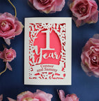 A first wedding anniversary card, laser cut and personalised with names. 