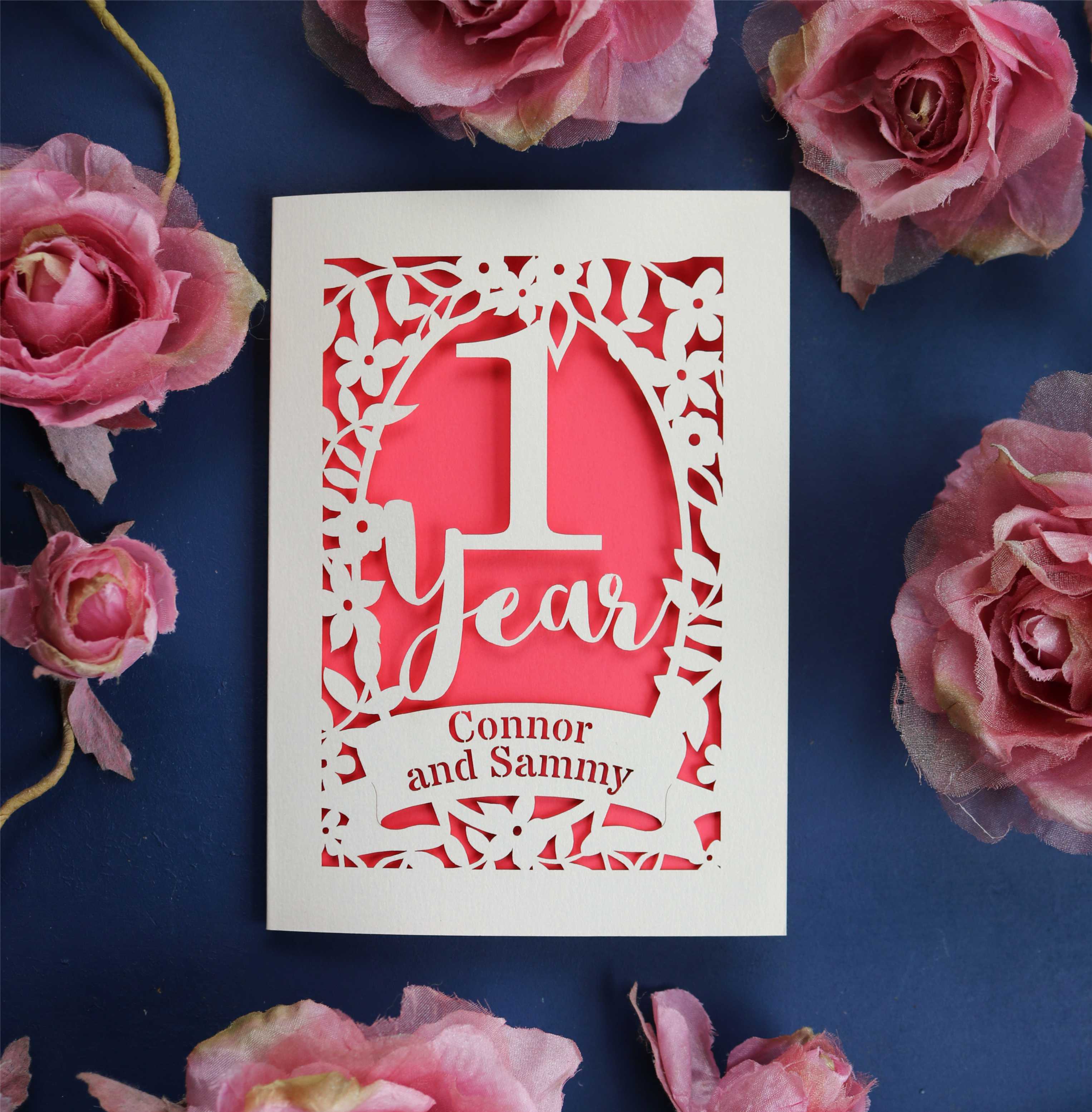 A first wedding anniversary card, laser cut and personalised with names. 