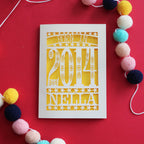 A laser cut birthday card for kids, personalised with a name and the words, "Born in 2014"
