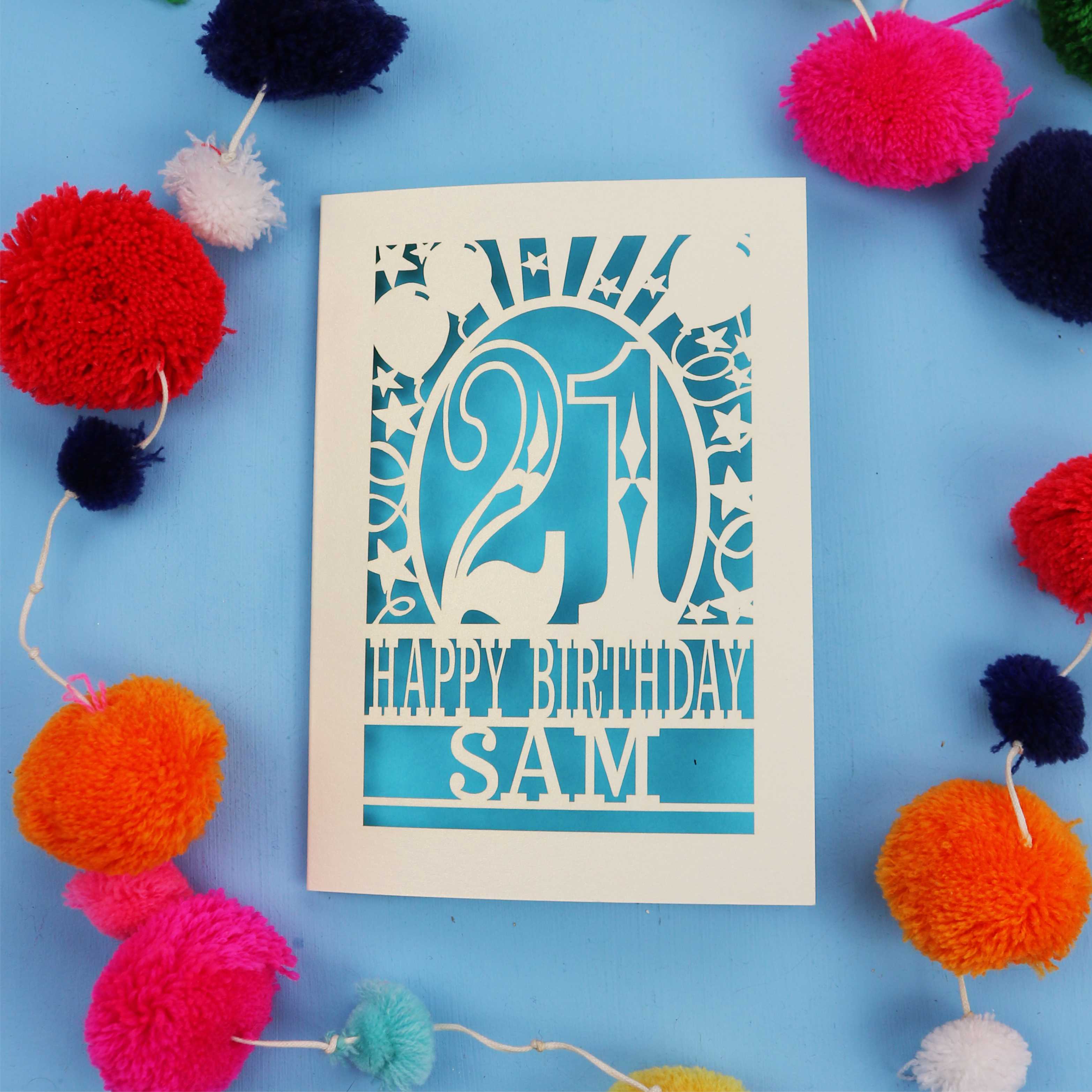 Personalized 21st birthday card with colourful pom-poms on a blue background