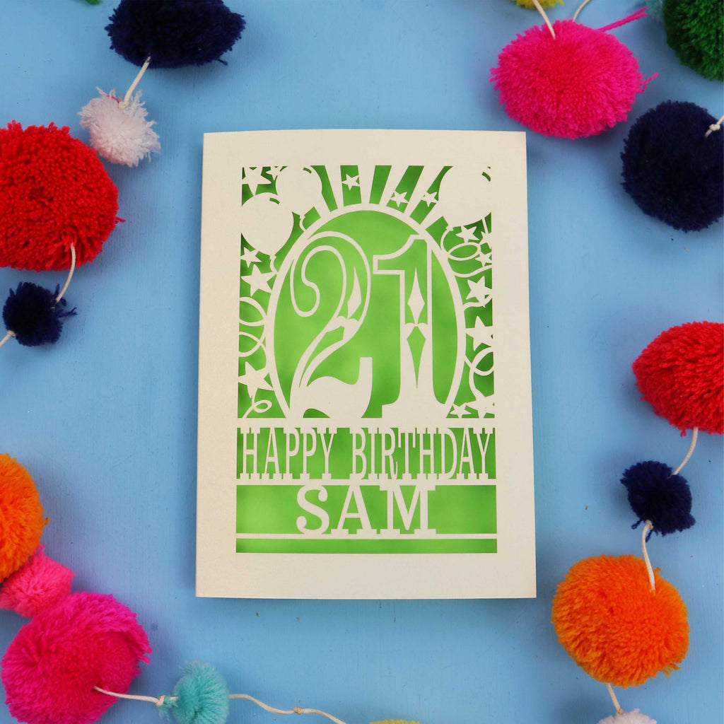Personalized 21st birthday card with colourful pom-poms on a blue background