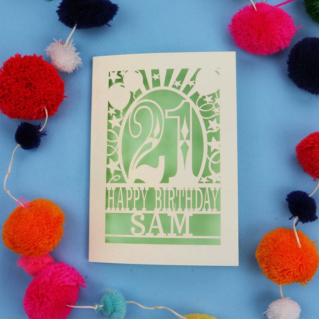 Personalized 21st birthday card with colourful pom-poms on a blue background