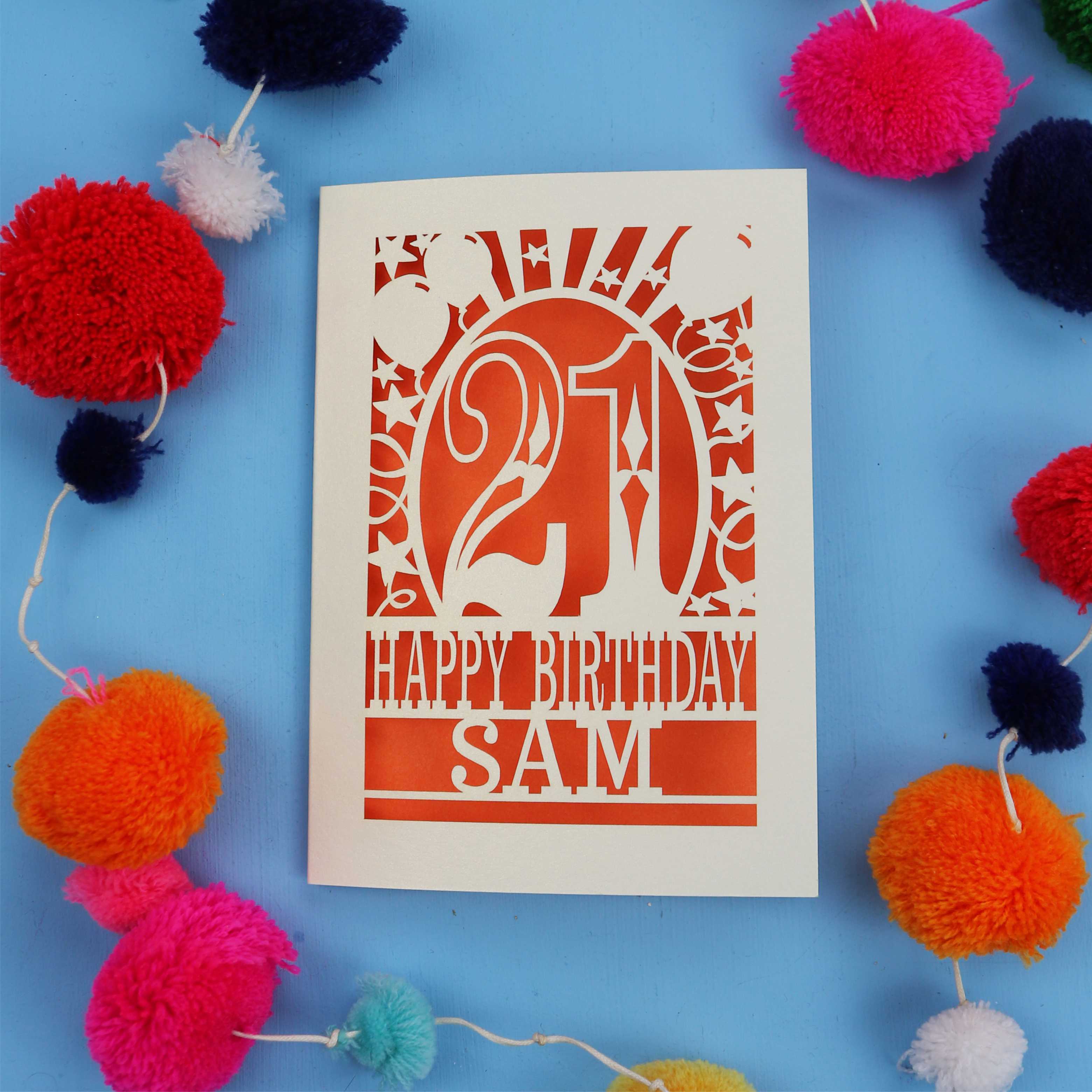 Personalized 21st birthday card with colourful pom-poms on a blue background
