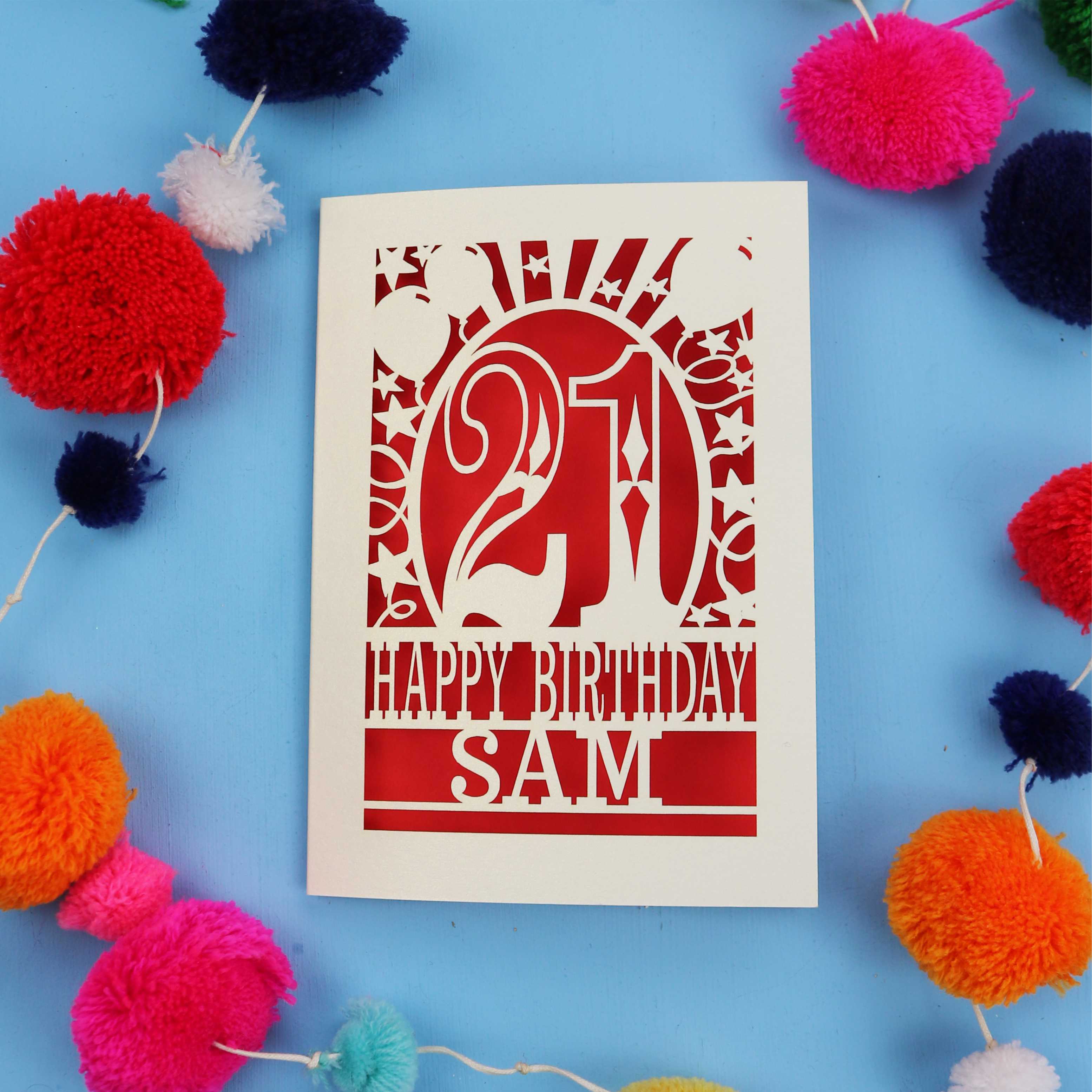 Personalized 21st birthday card with colourful pom-poms on a blue background
