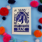 Personalized 21st birthday card with colourful pom-poms on a blue background