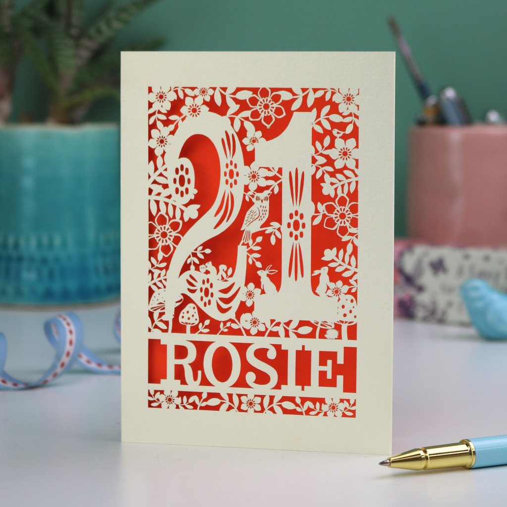 A laser cut 21st birthday card, personalised with the name "Rosie", with the number 21 in the centre and woodland theme design