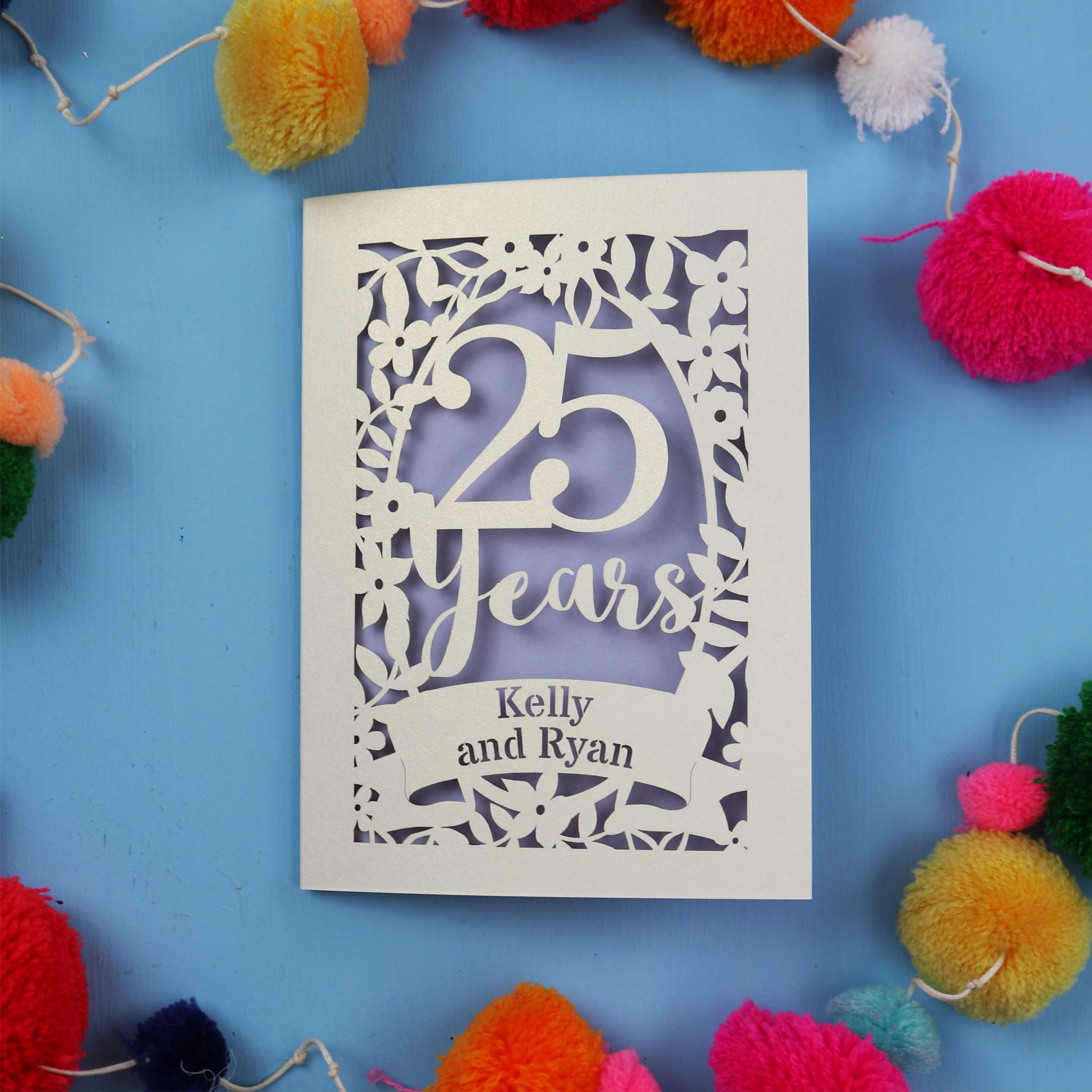 Silver Anniversary Card with '25 Years' and 'Kelly and Ryan' text on a blue background with colourful pom-poms.