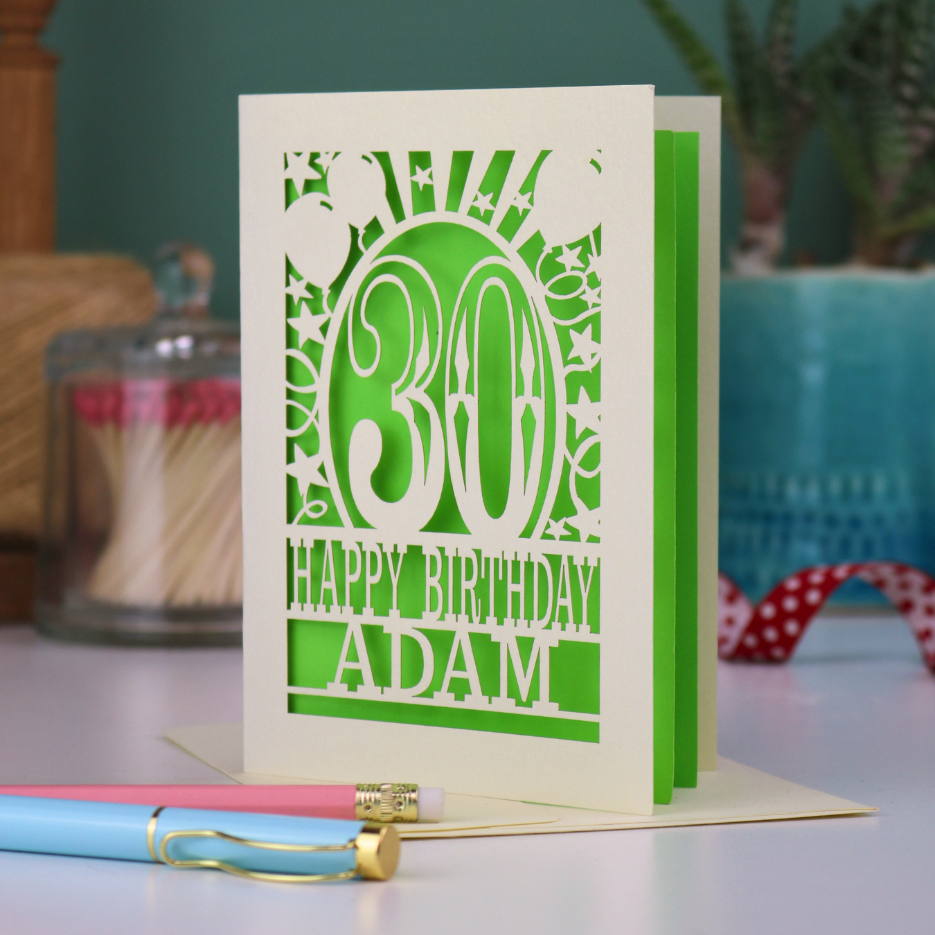 A personalised 30th birthday card with laser cut 30 design and text "Happy Birthday Adam"