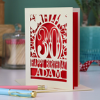 A personalised 30th birthday card with laser cut 30 design and text "Happy Birthday Adam"