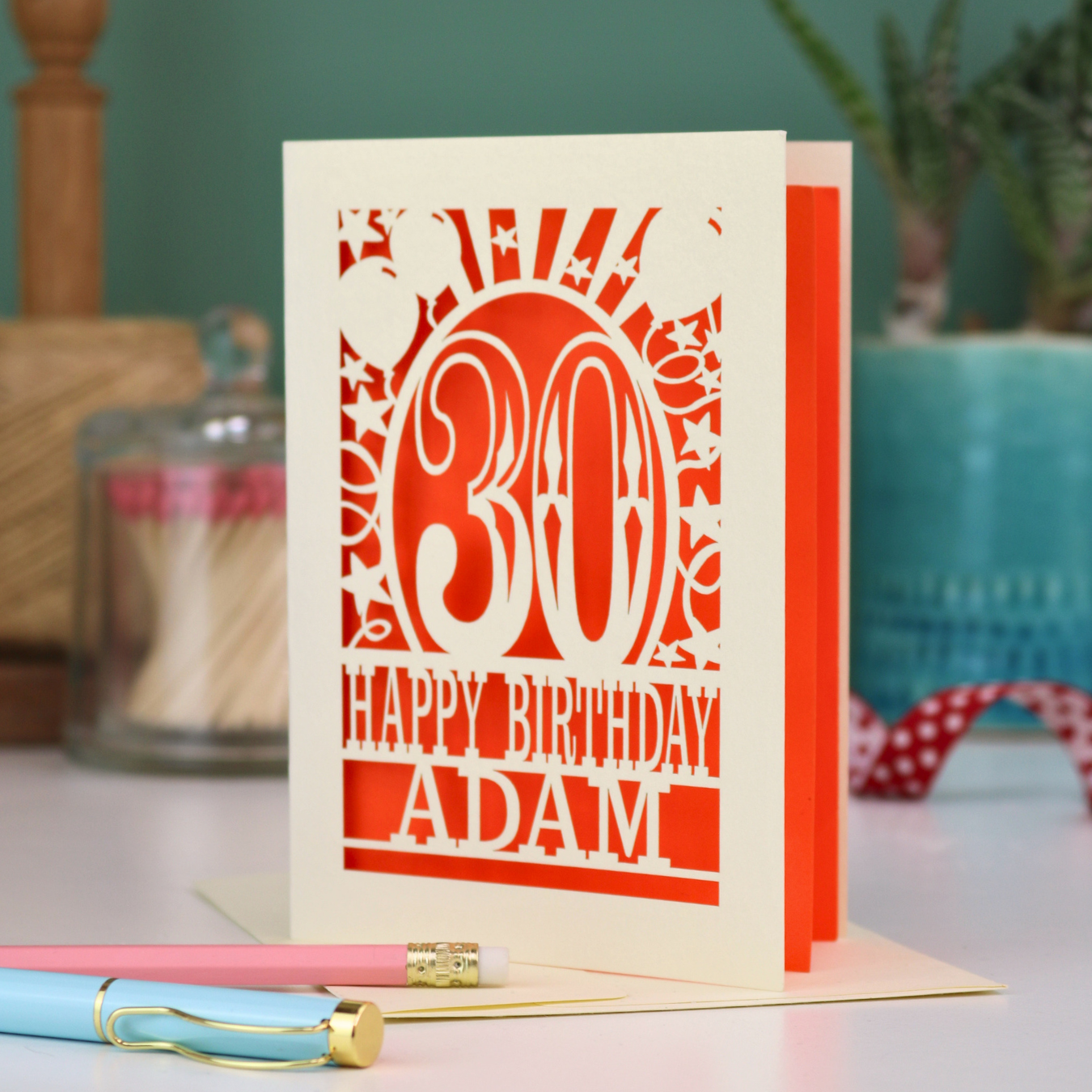A personalised 30th birthday card with laser cut 30 design and text "Happy Birthday Adam"