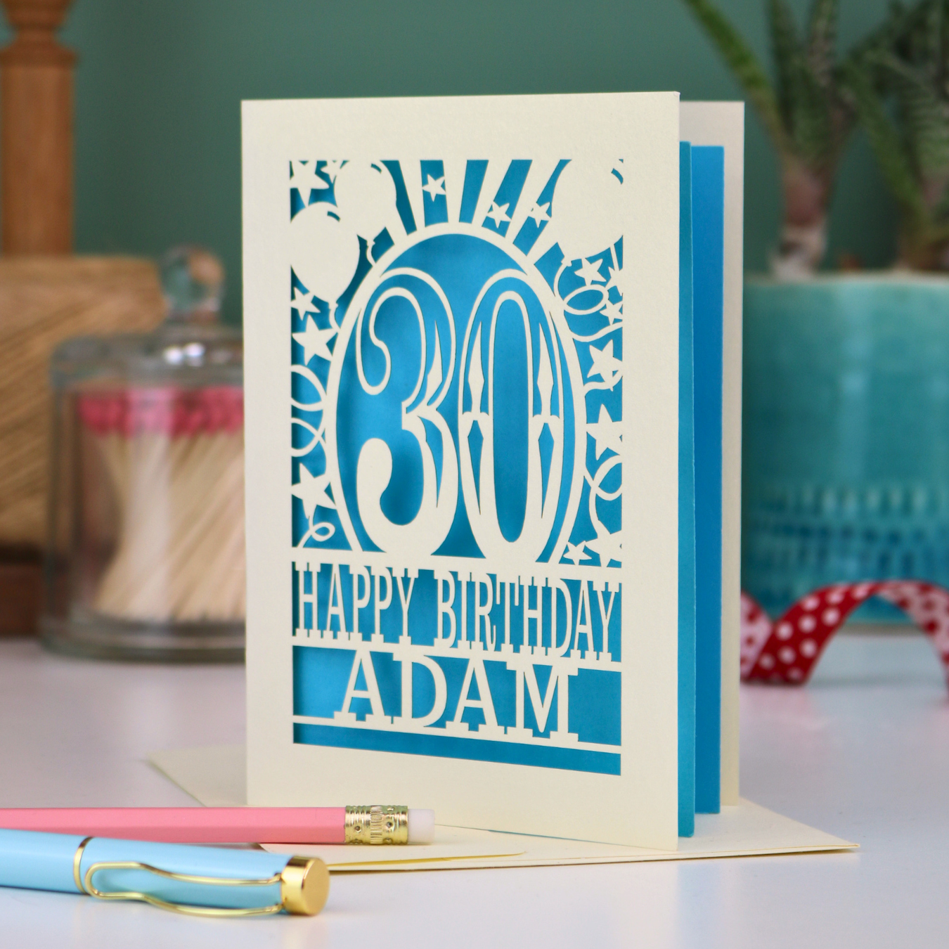 A personalised 30th birthday card with laser cut 30 design and text "Happy Birthday Adam"