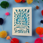 Decorative 30th birthday card with colourful pom-poms on a blue 