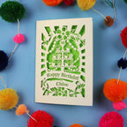 Decorative 30th birthday card with colourful pom-poms on a blue 