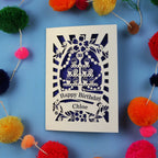 Birthday card with decorative elements on a blue background