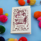 30th Birthday Card with '30 James' design on a blue background with colourful pom-poms.