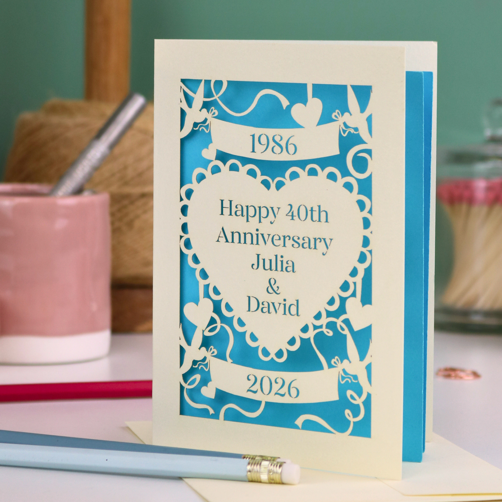 40th anniversary card with decorative elements on a blurred background