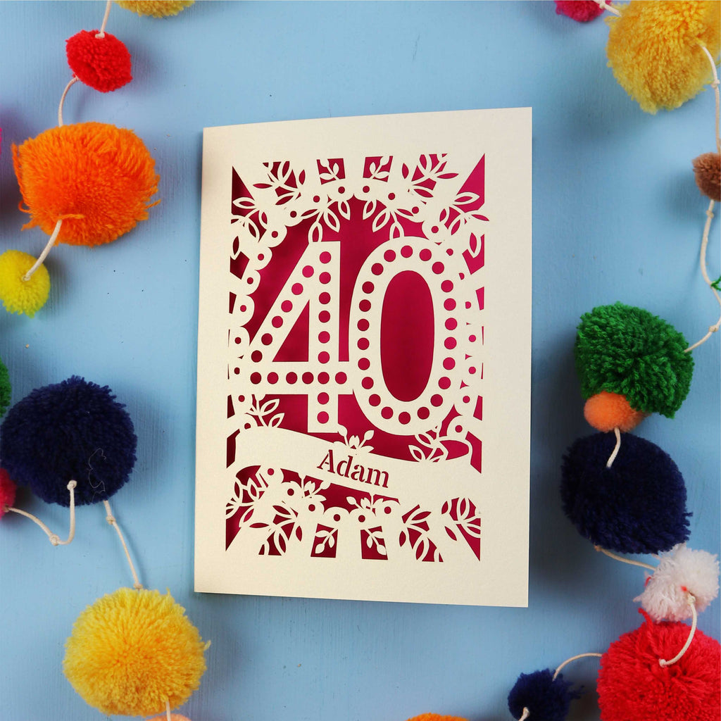 Laser cut 40th Birthday Card with '40' design on a blue background with colourful pom-poms