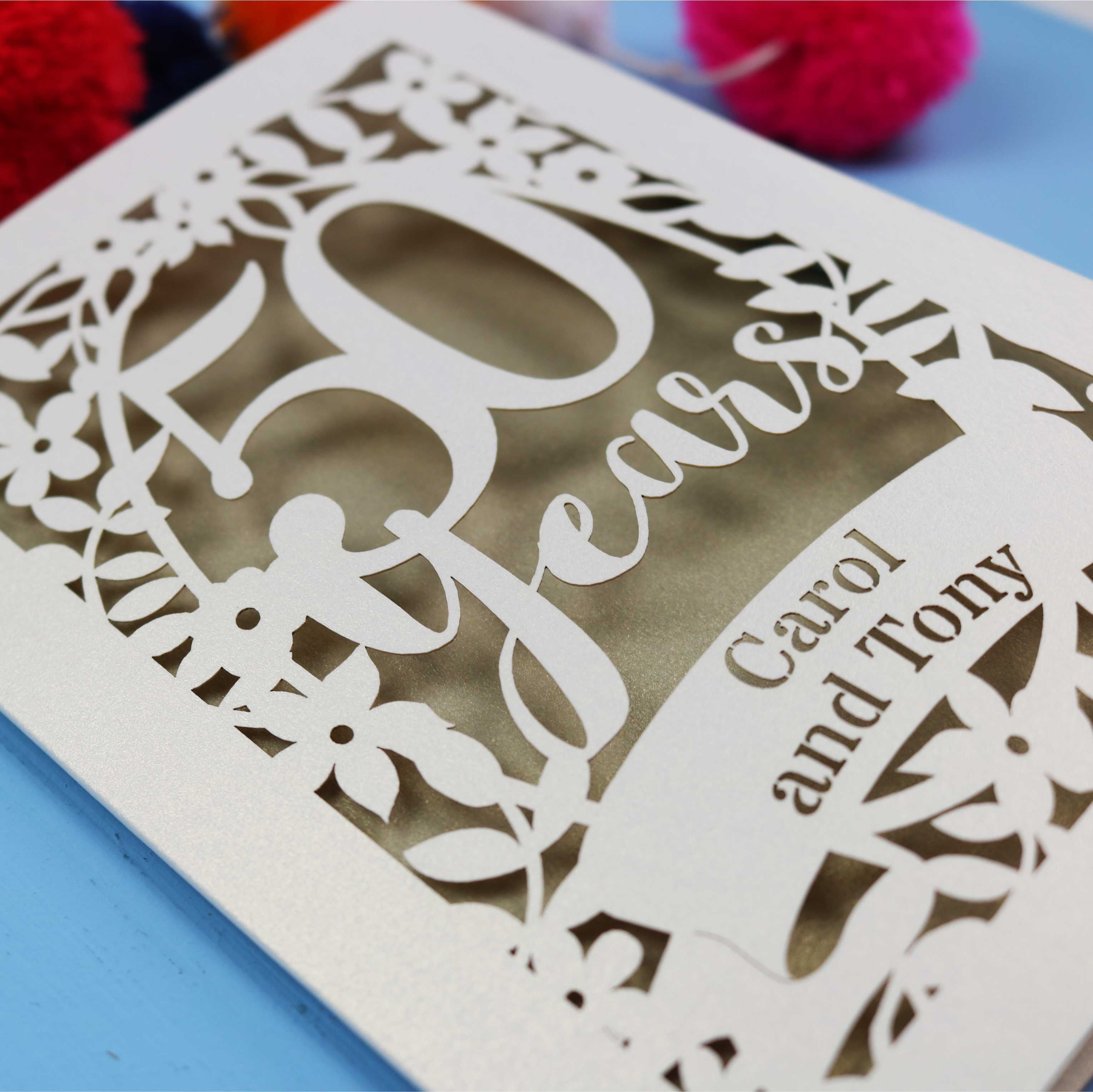Laser cut Card with '50 Years' and 'Carol and Tony' text on a blue background