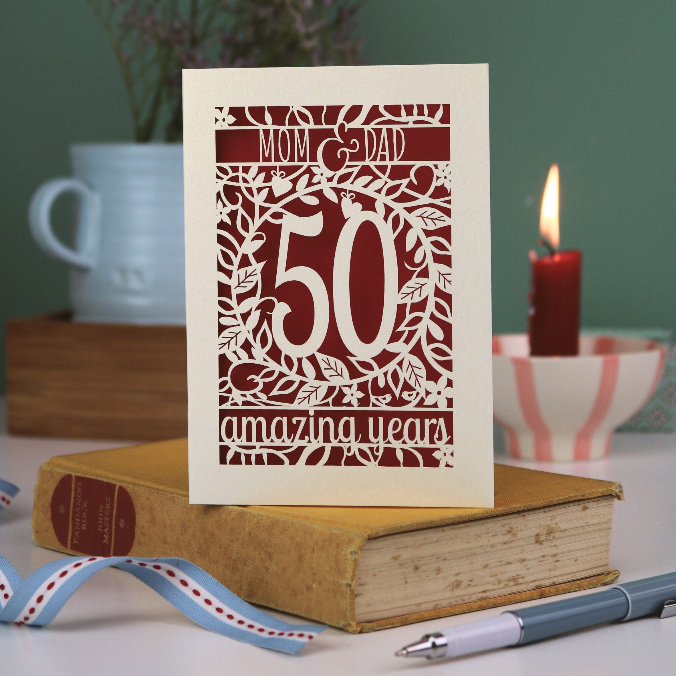 A laser cut Golden anniversary card personalised for Mom and Dad, 50 Amazing years