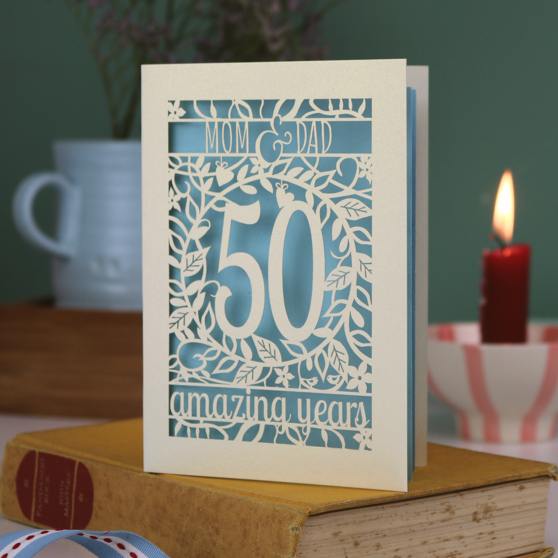 A laser cut Golden anniversary card personalised for Mom and Dad, 50 Amazing years
